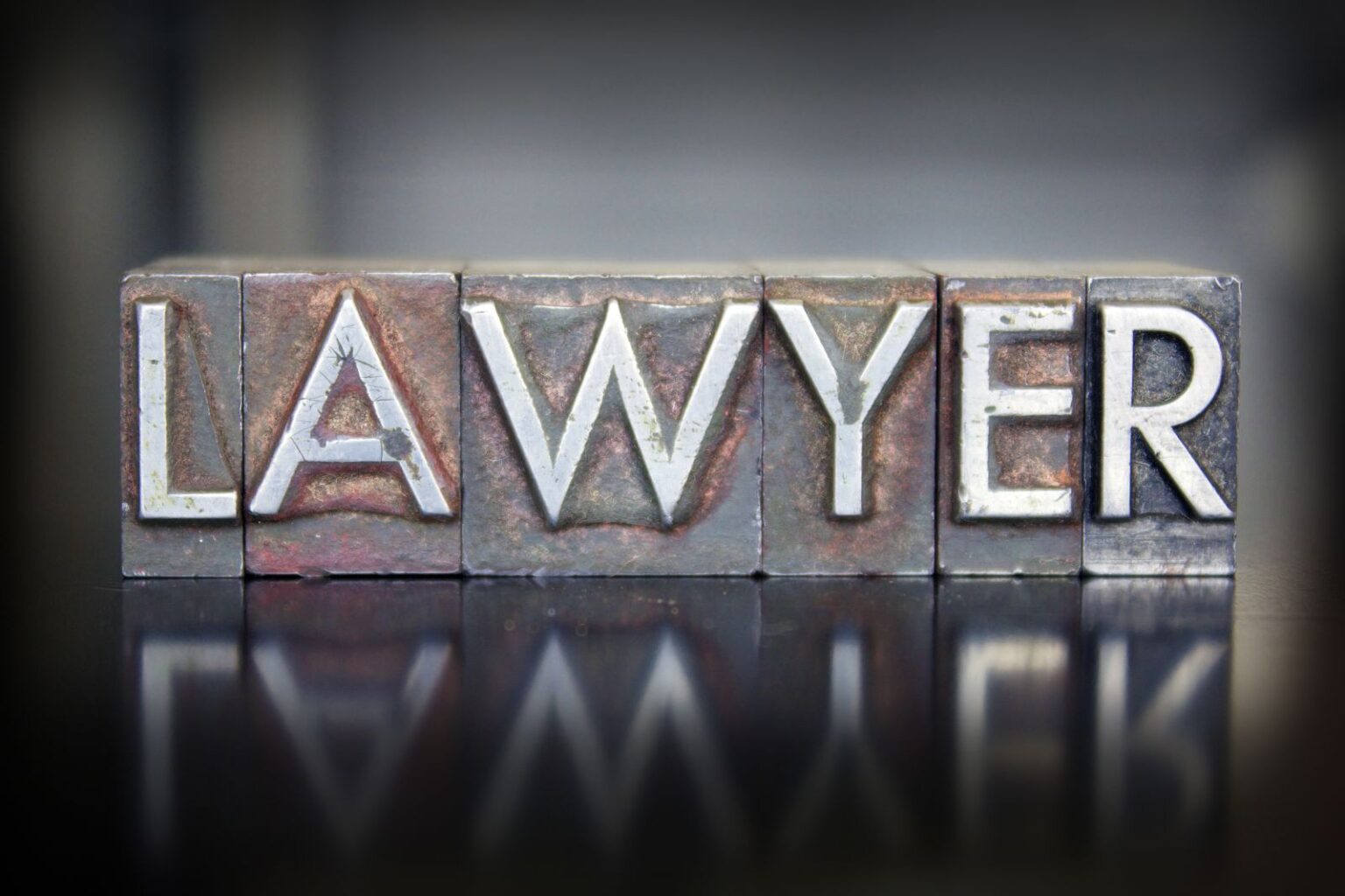 The word LAWYER written in vintage lead letterpress type